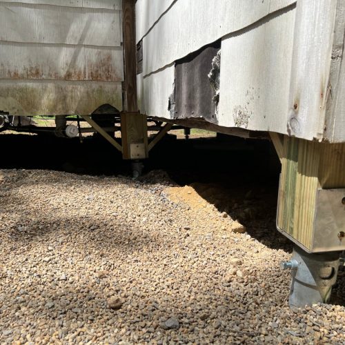 install screw piles under an existing structure